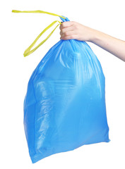 blue garbage bag with trash in hand isolated on white