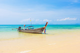 Fototapeta Tulipany - Long tail boat on tropical beach, Krabi, Thailand