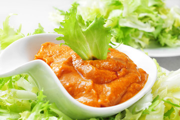 Canvas Print - escarole endive with romesco sauce, a typical salad from Catalon