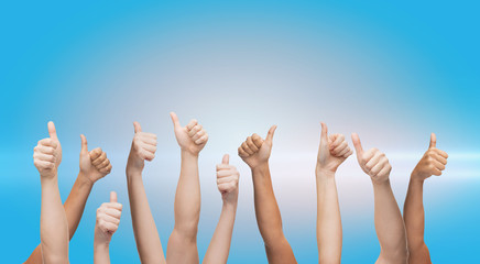 human hands showing thumbs up