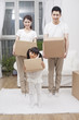 © eastfenceimage - .Family moving to a new house .