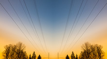 Electric Power Lines At Sunset
