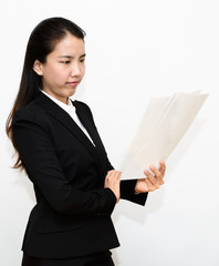 Thai business woman reading documents