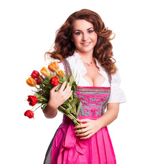 Wall Mural - junge Frau im Dirndl mit Tulpen