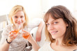 © Production Perig - Girls having a toast in a sofa
