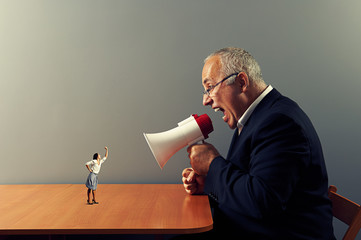 Poster - woman showing fist at big angry boss