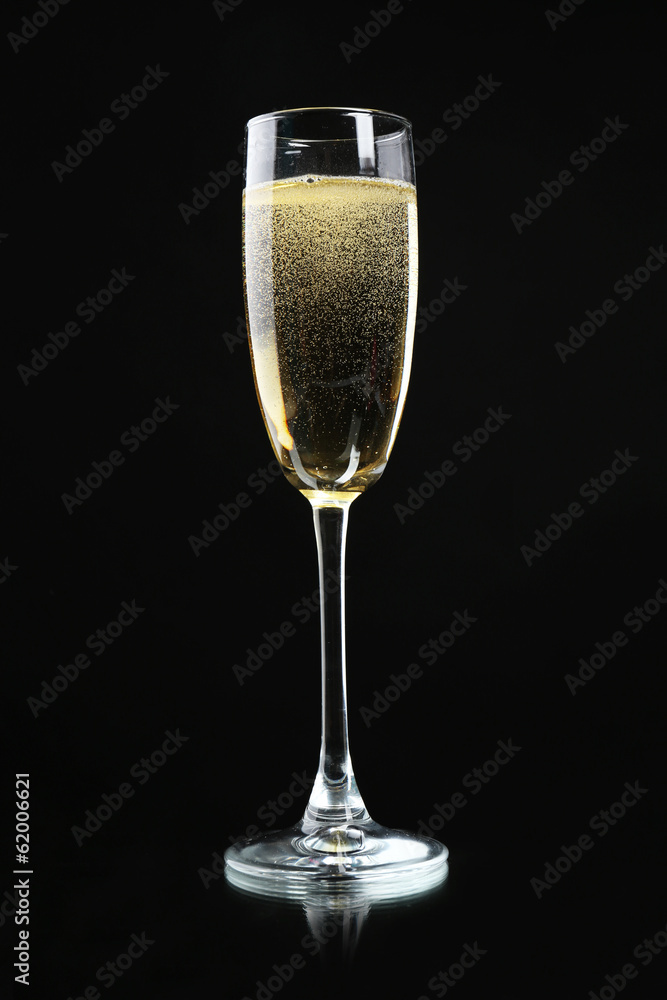 Glass of champagne, on black background