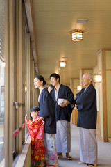 three-generation family in yukata coming to hot spring