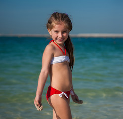 happy little girl on the beach