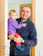 © DariaTrofimova - man entering in  apartment with daughter