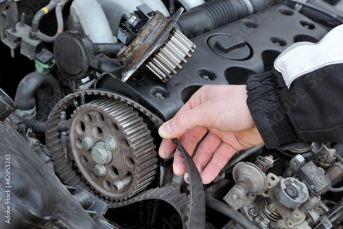Fotografie, Obraz Service, car mechanic replace timing belt at camshaft of engine