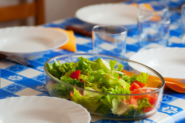 Fresh lettuce and tomato salad in the table, ready to meal