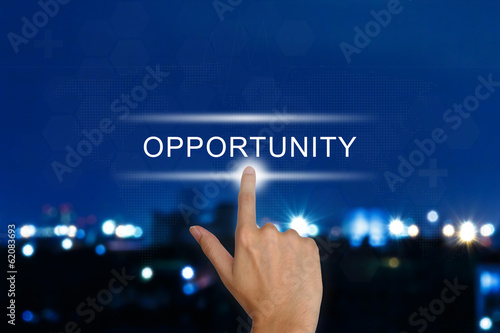 Fotografía hand pushing opportunity button on touch screen