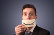 © ra2 studio - Happy businessman holding funny white card on his mouth