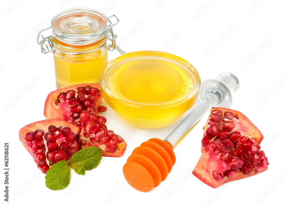 Sweet honey with pomegranate isolated on white