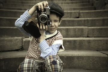 Child with vintage camera