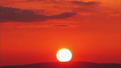 Wall Mural - orange - red sunset with sun, time lapse