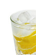 Water with lemons and ice cube isolated (selective focus)
