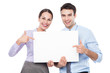 © pikselstock - Business couple holding a placard