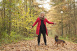 © DNF-Style - Smiling middle aged woman in the forest with her dog