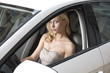 © photoCD - sexy blonde woman with elegant style sitting in a white car