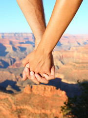 Wall Mural - Couple holding hands hiking romantic, Grand Canyon