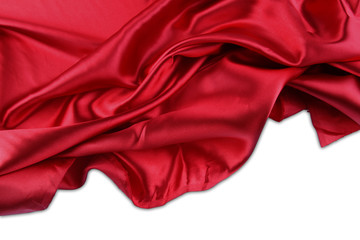 Red silk material on white. Copy space