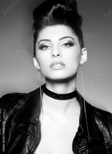 Fototapeta na wymiar beautiful punk woman model posing in leather jacket