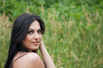 Young beautiful girl on a walk in the country