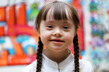 Wall Mural - Portrait of beautiful young girl on the playground.