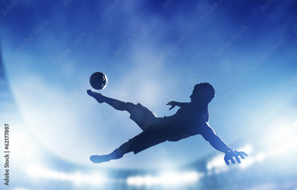 Football, soccer match. A player shooting on goal - obrazy, fototapety, plakaty 