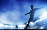 Fototapeta Sport - Football, soccer match. A player shooting on goal