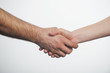 © krutenyuk - Man and woman shaking hands. Isolated on white background.