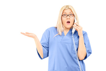 Poster - Surprised female doctor talking on the phone