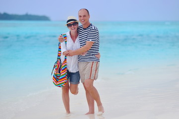 happy young couple have fun on beach