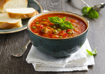 Wall Mural - Bowl of minestrone soup with bread