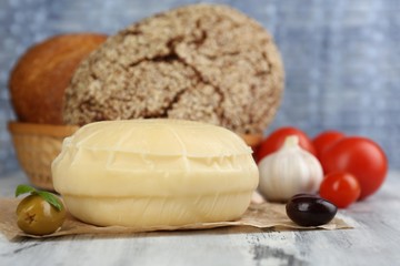 Tasty Italian cheese on wooden table