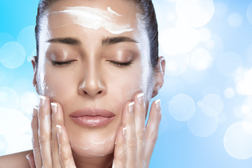 Wall Mural - beautiful spa girl with cream on her face. skincare concept