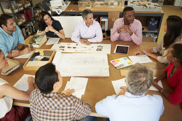 Wall Mural - Group Of Architects Sitting Around Table Having Meeting