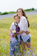 © stormy - young woman & boy together in summer wheat field