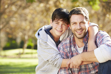 Canvas Print - Portrait Of Father And Son In Countryside