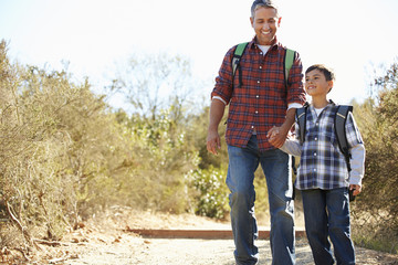 Sticker - Father And Son Hiking In Countryside Wearing Backpacks