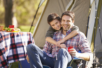 Canvas Print - Father And Son Enjoying Camping Holiday In Countryside