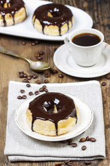 Wall Mural - Delicious donut with chocolate on wooden table