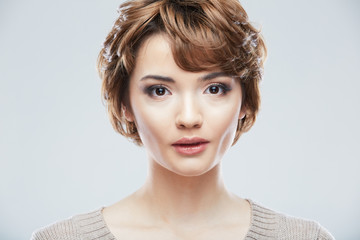 Young woman close up face beauty portrait on white background.