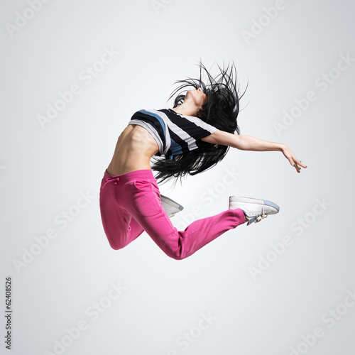 Naklejka samoprzylepna Athletic girl dancing jumping