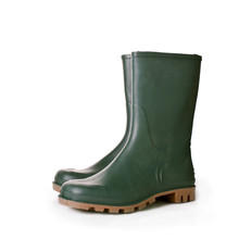 Green Ruber Boots On White Background