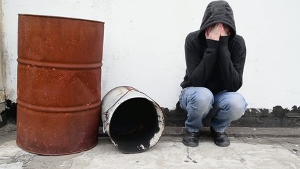 Wall Mural - Man with problems alone on the street. Drug addiction concept.