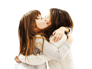 A sweet girl kissing her elder sister