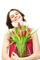 young beautiful woman with a vase of flowers, isolated on white